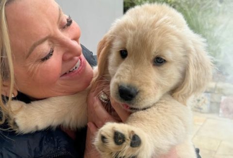 a photo of Kristine Carlson with her new puppy Bohdi, feeling connection and love